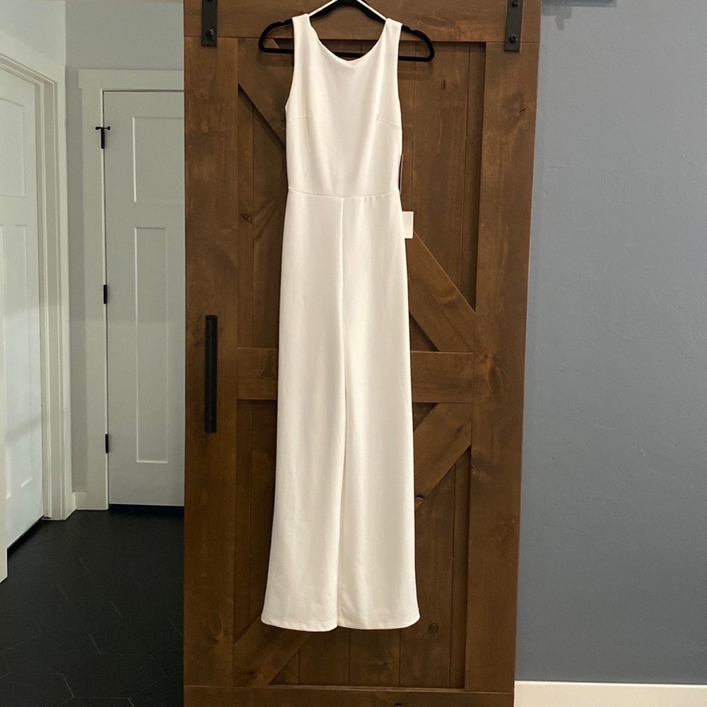 NWT white polyester jumpsuit.